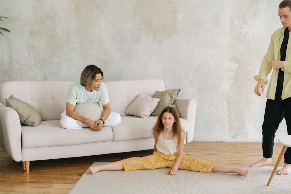 Smiling man in comfortable clothes stretching in his living room.